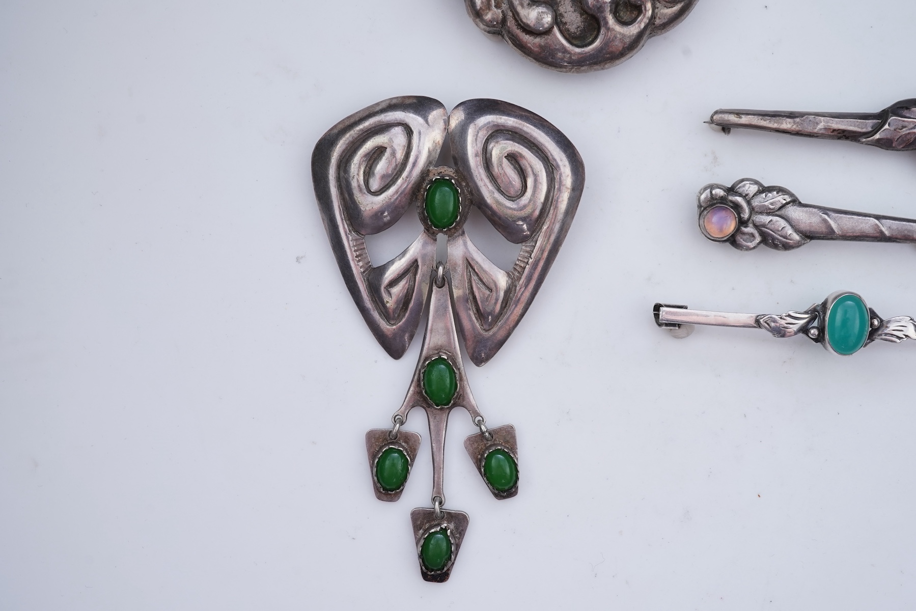 A collection of five Arts & Crafts silver brooches, Denmark, early-mid 20th century